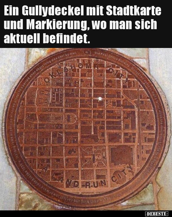 Ein Gullydeckel mit Stadtkarte und Markierung, wo man sich..